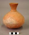 Ceramic jar, round base, flared neck with incised neck decoration, fire clouded