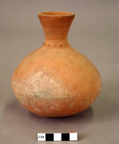 Ceramic jar, round base, flared neck with incised neck decoration, fire clouded