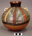 Middle Nasca collared jar with lugs painted with vertical bands of wavy lines