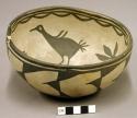 Bowl, black on cream interior and exterior design, bird motif