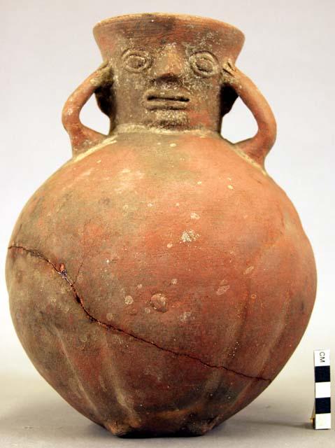 Jar of coarse red ware, human form