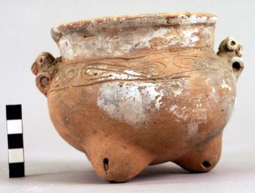 Pottery tripod bowl - incised decoration; 2 horizontally pierced effigy lugs