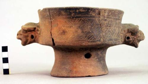 Earthen vase, 2 animal heads