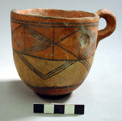 Small earthen mug