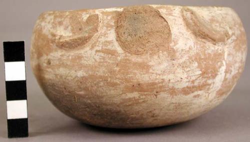 Broken effigy vessel of cream slipped ware