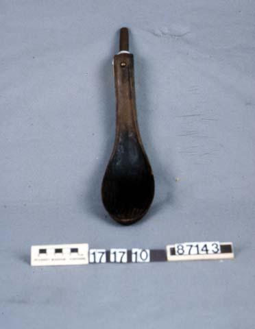 Wooden spoon. Possibly made of hemlock,; decorated with brass tack