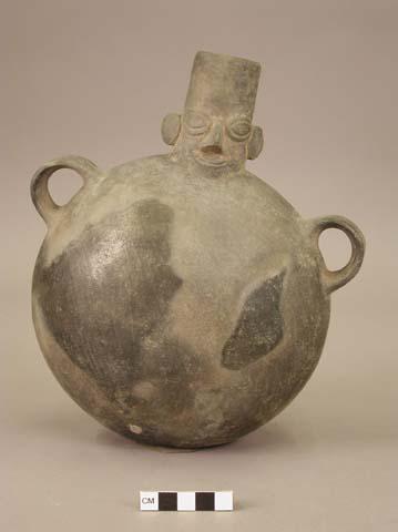 Flask shaped vessel of black ware