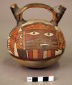 Double spout bottle painted with polychrome serpentine creature