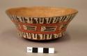 Bowl painted with geometric motifs (abstract trophy heads?)