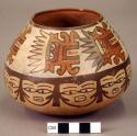 Bowl painted with "bloody mouth" mask motif and female? human faces