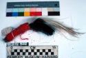 Man's brush-like hair ornament - black and white feathers bound at +