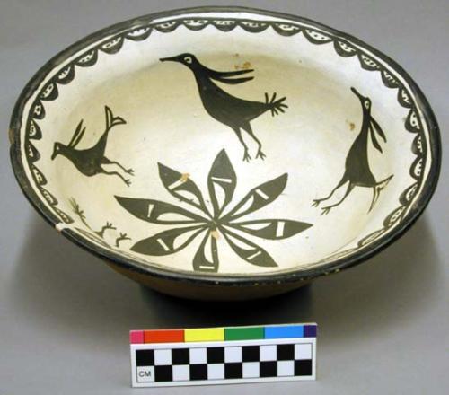 Painted pottery bowl. Bird and leaf designs inside.