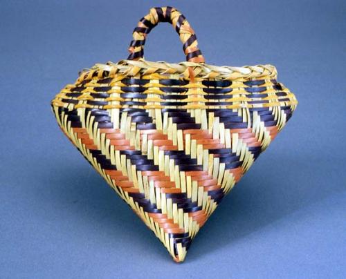 Heart-shaped basket with loop handle.