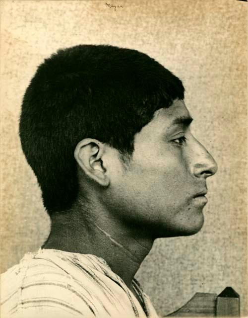 Close-up profile portrait of a young Chol man