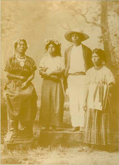 Studio portrait of three Maya women and a Maya man