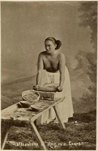 Studio-staged portrait of a Maya woman making tortillas