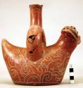 Stirrup vessel, animal effigy with incised scroll and snake designs