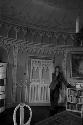 Man on telephone in ornate room