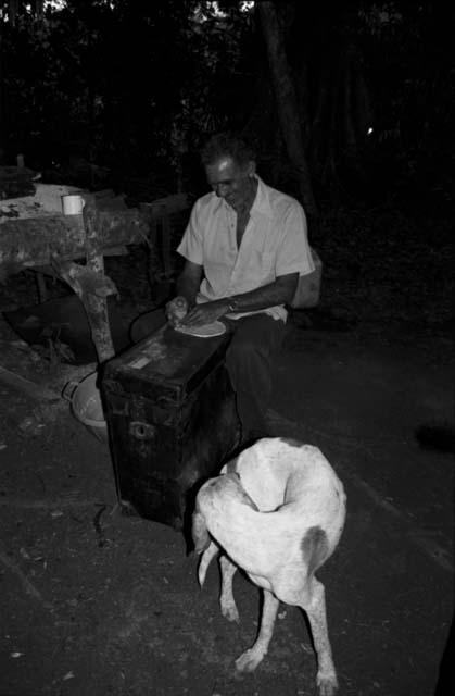 Anatolio Lopez making tortillas in camp