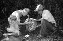 Ian Graham and Anatolio epoxying altar fragments at La Corona