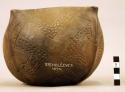CAST of square-topped pottery vessel with incised spiral ornament