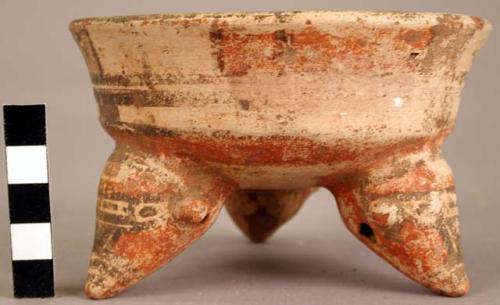 Ceramic tripod bowl, polychrome, animal head effigy rattle legs