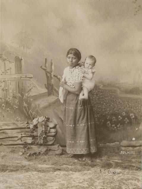 Studio portrait of Maya woman and baby