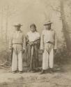 Studio portrait, young woman and two young men