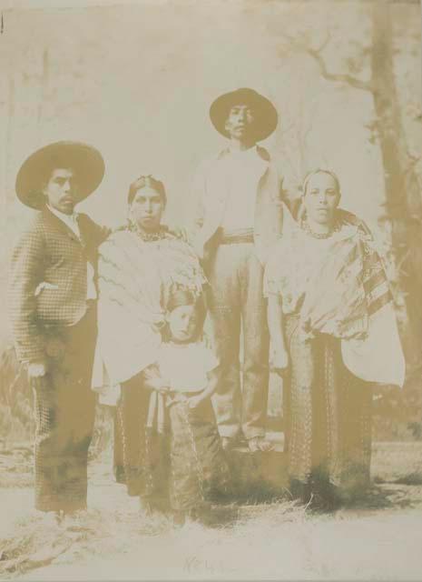 Group portrait of Maya men, women and child