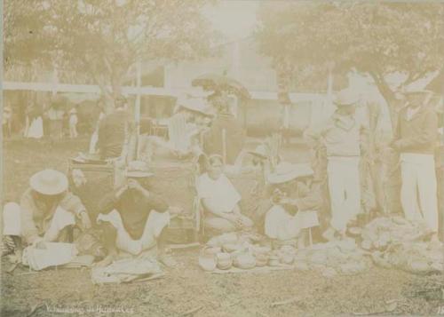 Market scene, people selling huacales