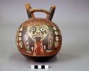 Double spout bottle painted with polychrome "anthropomorphic mythical being"