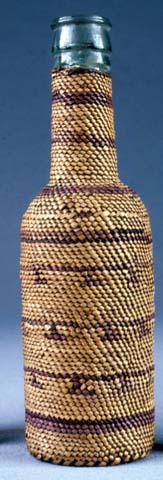 Bottle encased in basketry