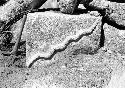 Highland on Lake Titicaca, stone with snake design