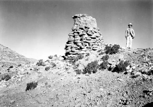 Highland on Lake Titicaca, man by stone tower