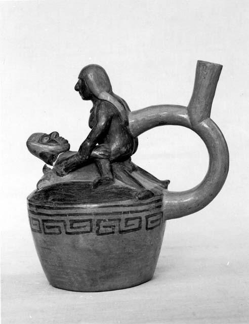 Ceramic vessel with figures engaged in a sexual act