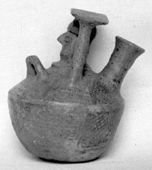 Calleju du Higlas Pottery, decorated jar with off-center neck and human face