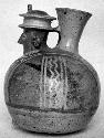 Calleju du Higlas Pottery, decorated jar with human form, off-center neck