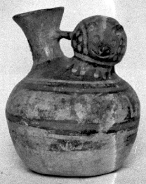 Calleju du Higlas Pottery, decorated jar with animal figure on neck