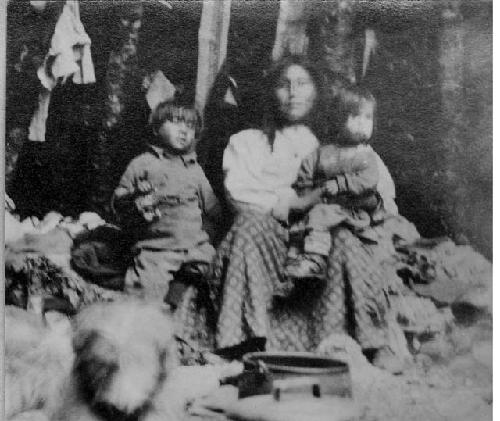 Woman with children, Ona Camp NE of Lake Fagnano