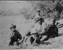 Group sitting in field, Ona Camp NE of Lake Fagnano