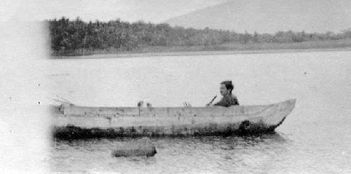 SL in canoe at Harberton. This is the canoe shipped to New York.