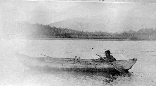 SL in canoe at Harberton. This is the canoe shipped to New York.