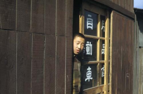 Man standing in doorway of building