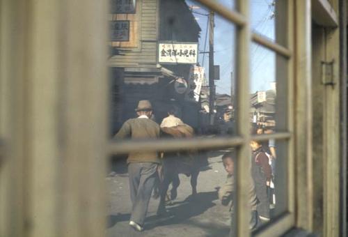 Looking through window at people on street