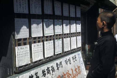 Boy reading signs