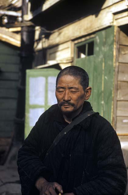 Man in front of building