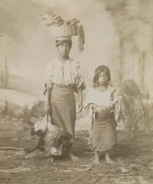 Studio portrait of two young Maya girls