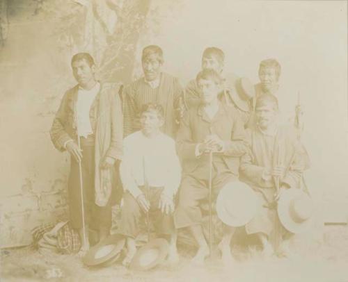 Studio portrait of group of seven men, cofrades