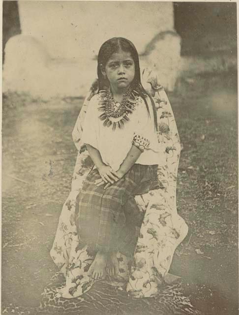 Young Maya girl seated for photograph