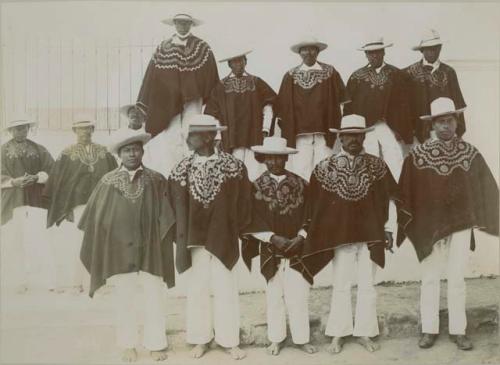 Group portrait of thirteen Mixco indian men